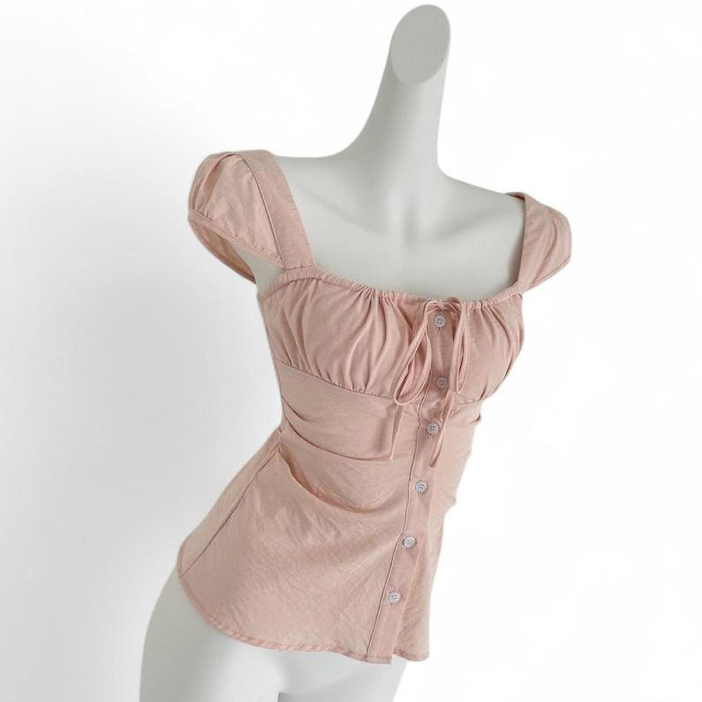 pink corset top with button up front and tie back
