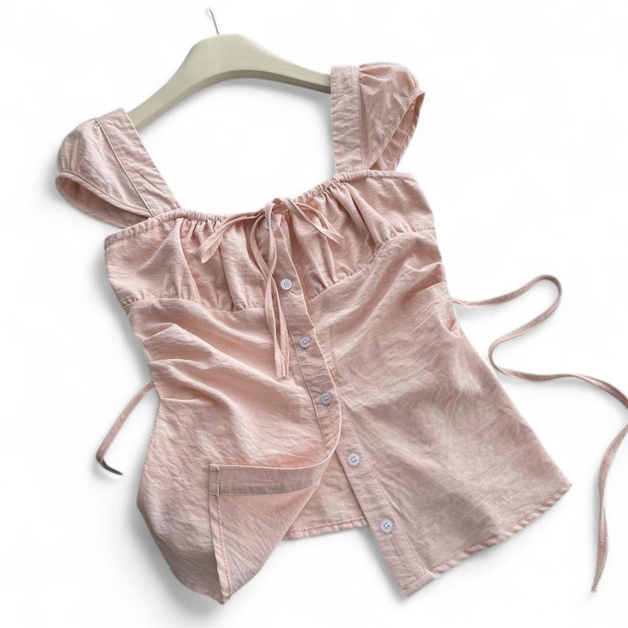 pink corset top with button up front and tie back