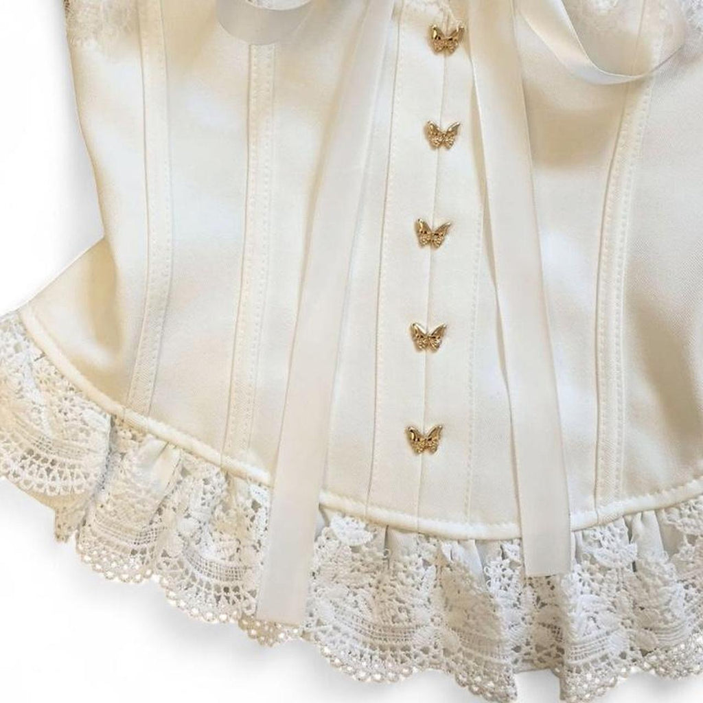 corset top with lace and bow details