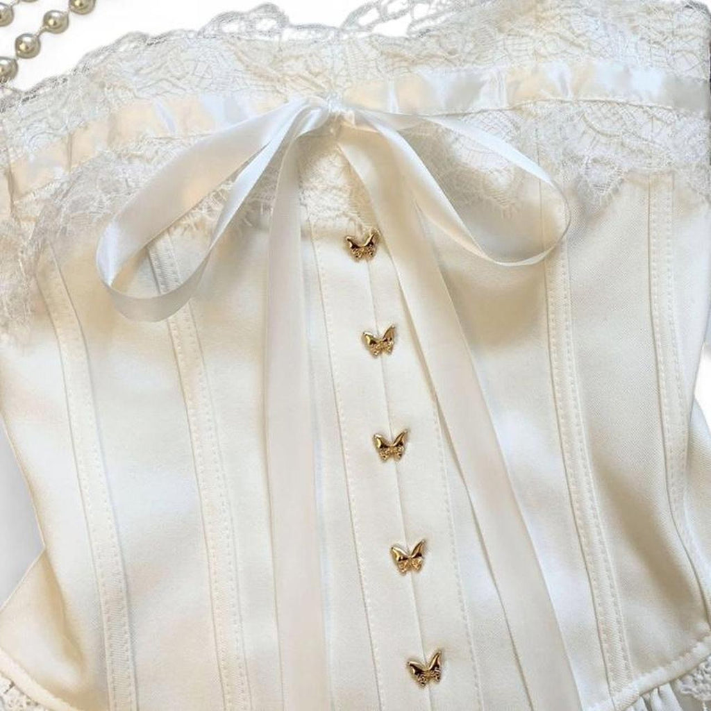 corset top with lace and bow details