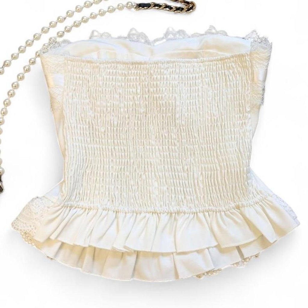 corset top with lace and bow details