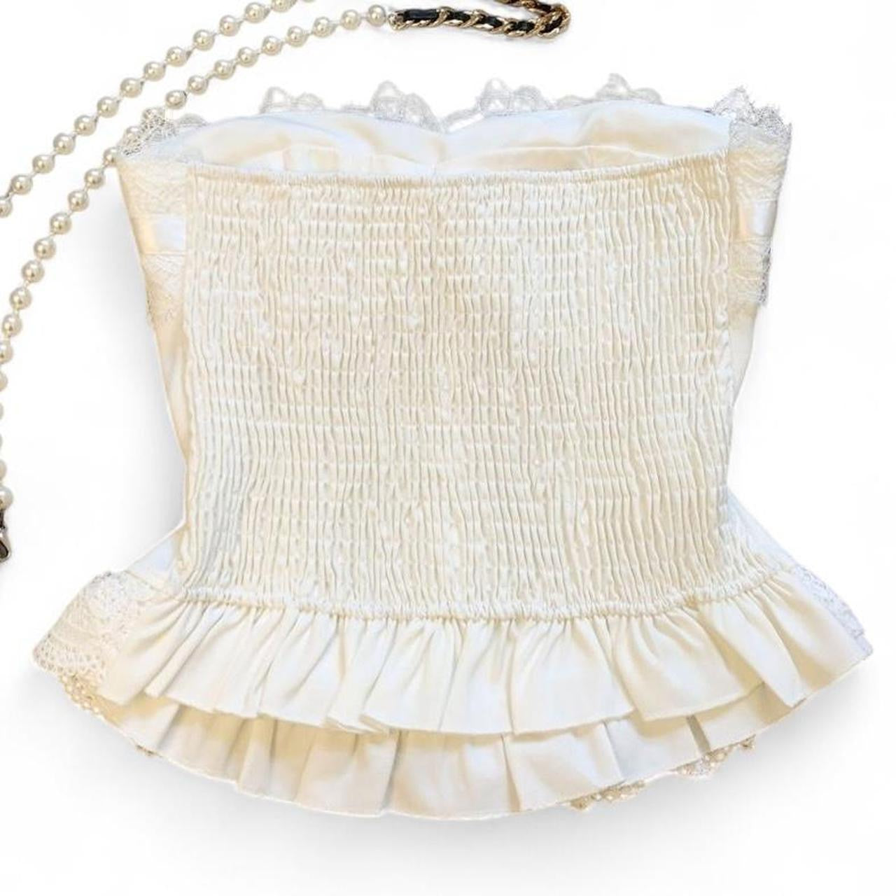 corset top with lace and bow details