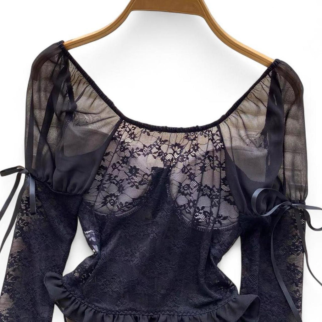 black lace corset top with sheer sleeves and ruffles