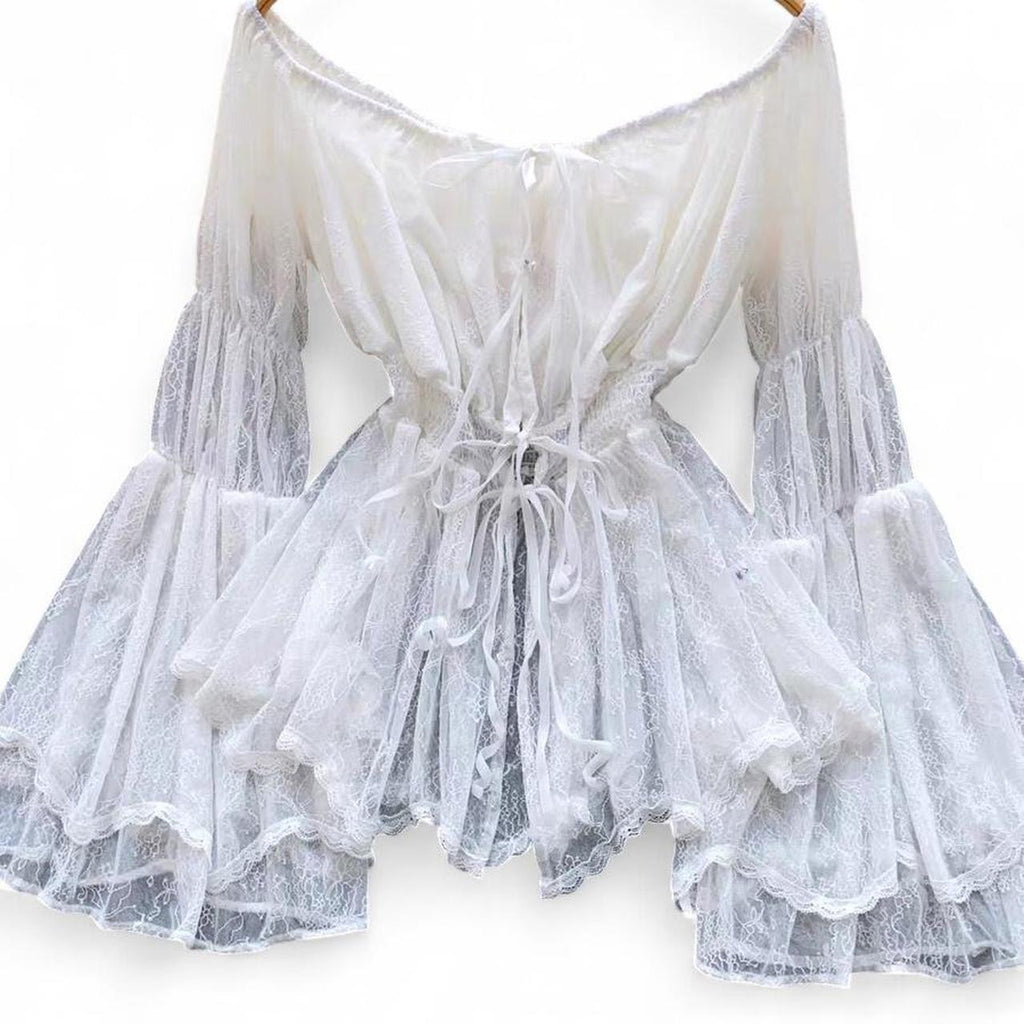 white lace off the shoulder blouse with bell sleeves and tie back